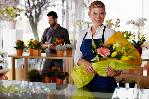 Woman standing outside florist