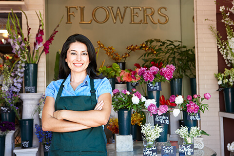 Woman standing outside florist